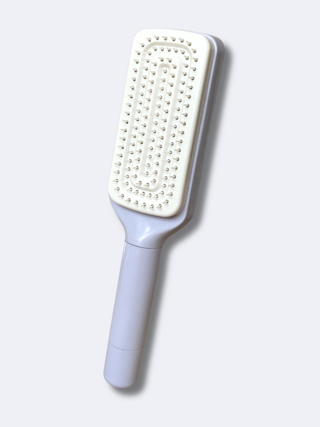 Self-cleaning hairbrush